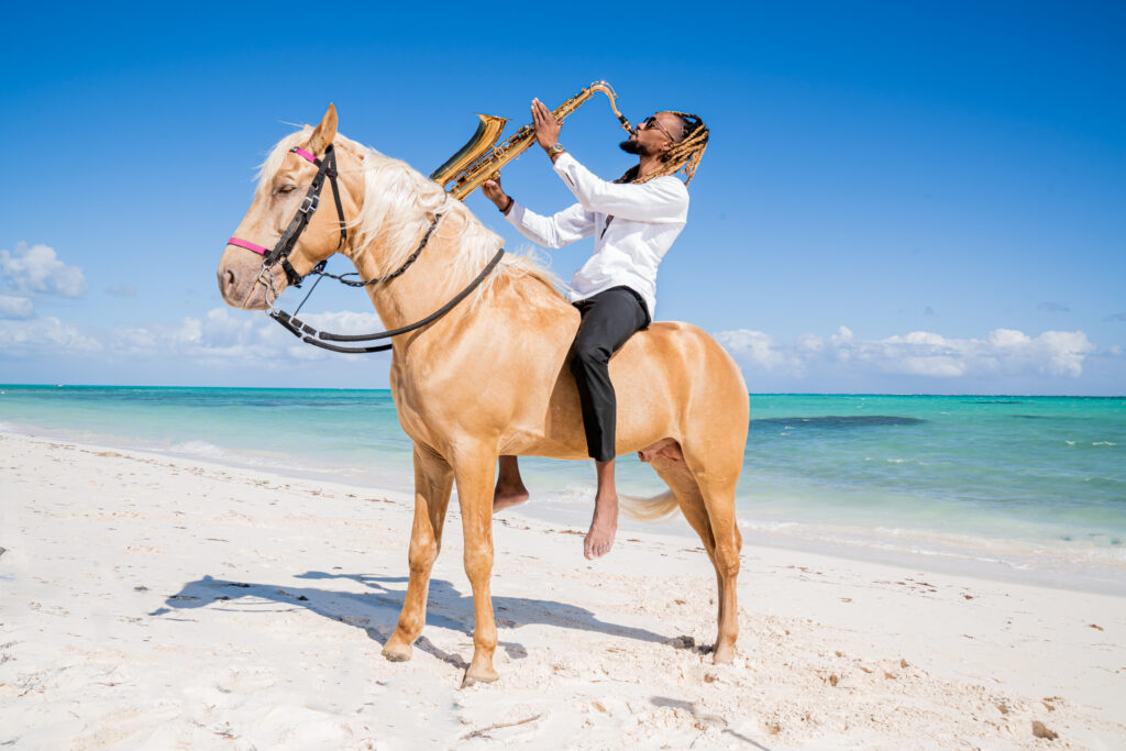 Moe & Goldie, Saxophonist on Horse In Turks & Caicos